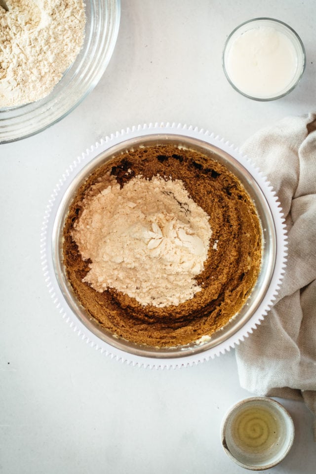 Overhead view of dry ingredients being incorporated into cake batter