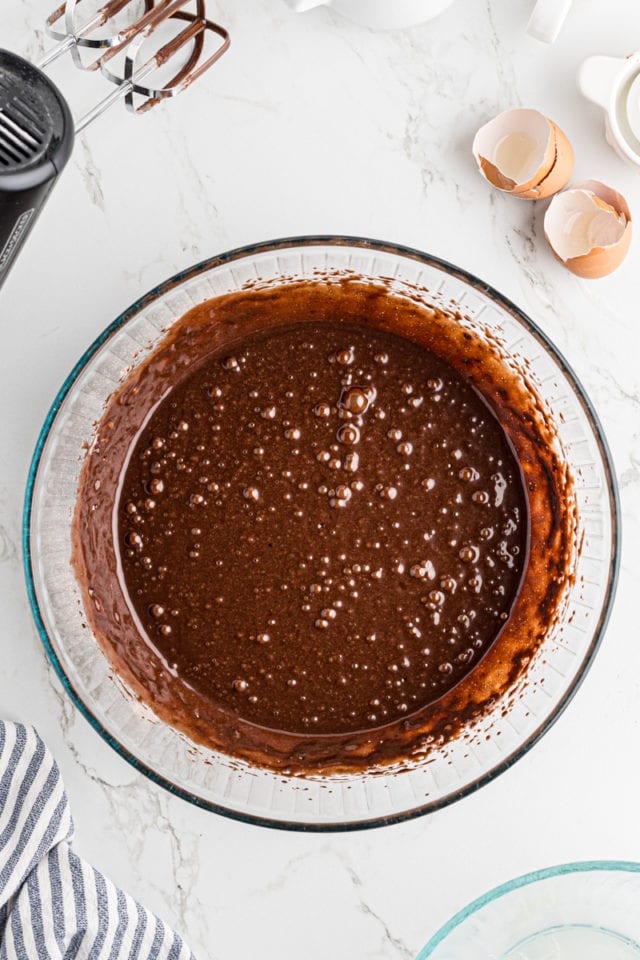 overhead view of mixed hot chocolate cupcake batter in a glass bowl