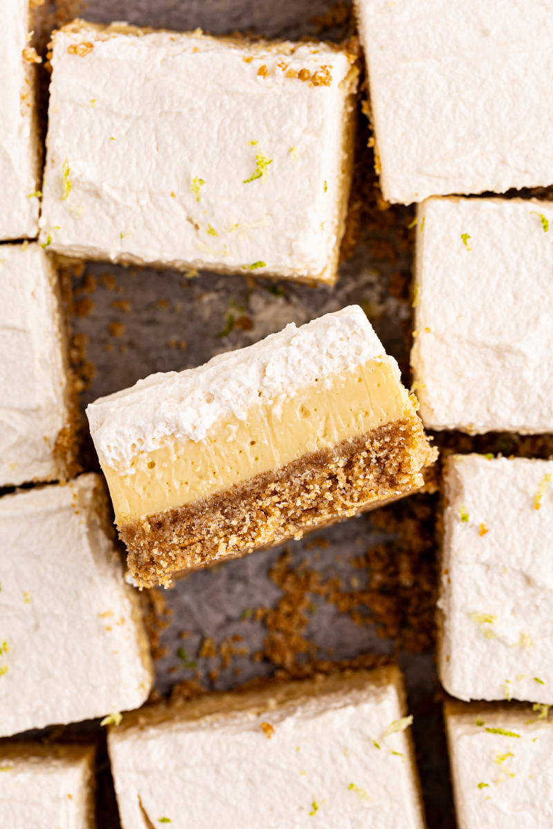 overhead view of sliced key lime pie bars, with one bar turned on its side