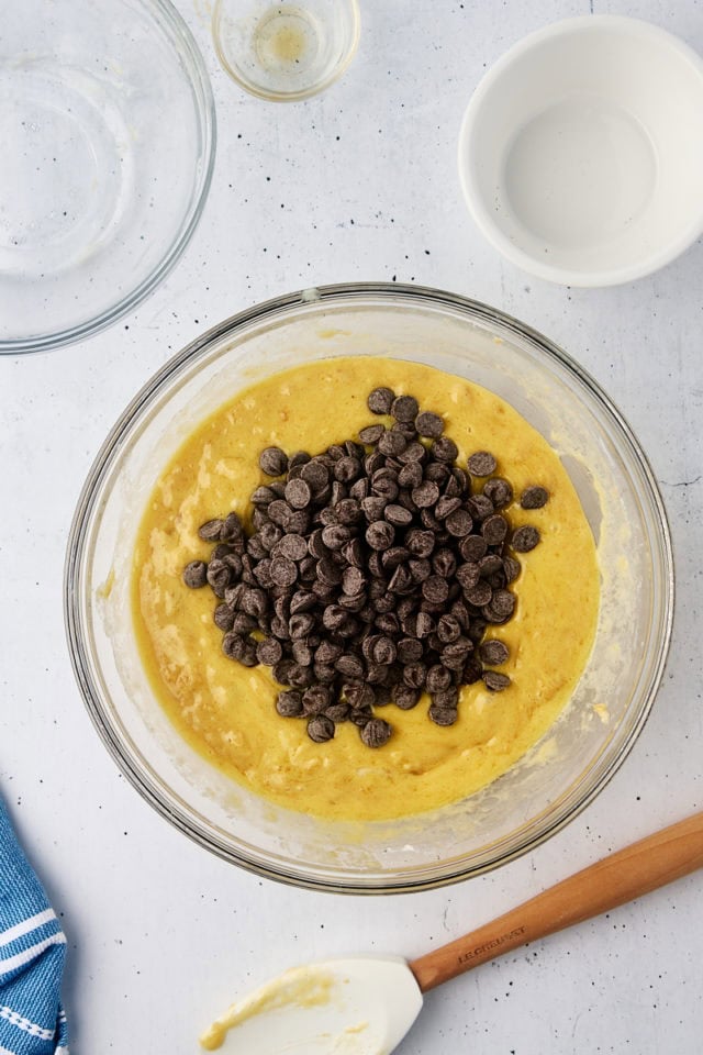 overhead view of chocolate chips added to muffin batter